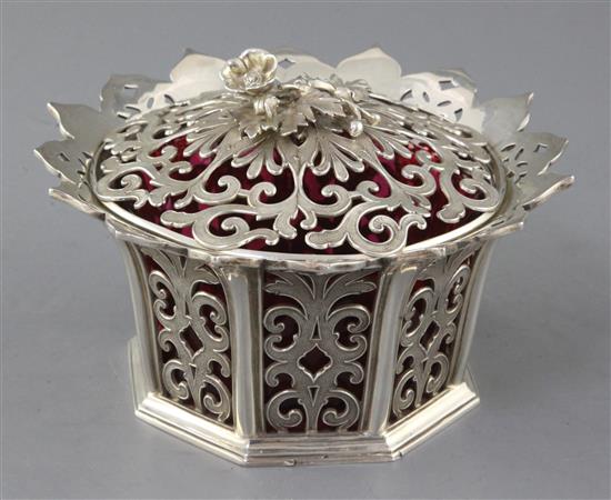 An early Victorian pierced silver bowl and cover with cranberry glass liner, 12.5 oz.